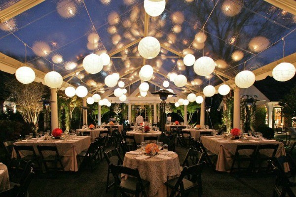 outdoor-wedding-reception-in-clear-tent-with-globe-lights.jpg